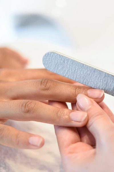 woman-nails-salon-receiving-manicure-with-nail-file_1139-1695_Easy-Resize.com